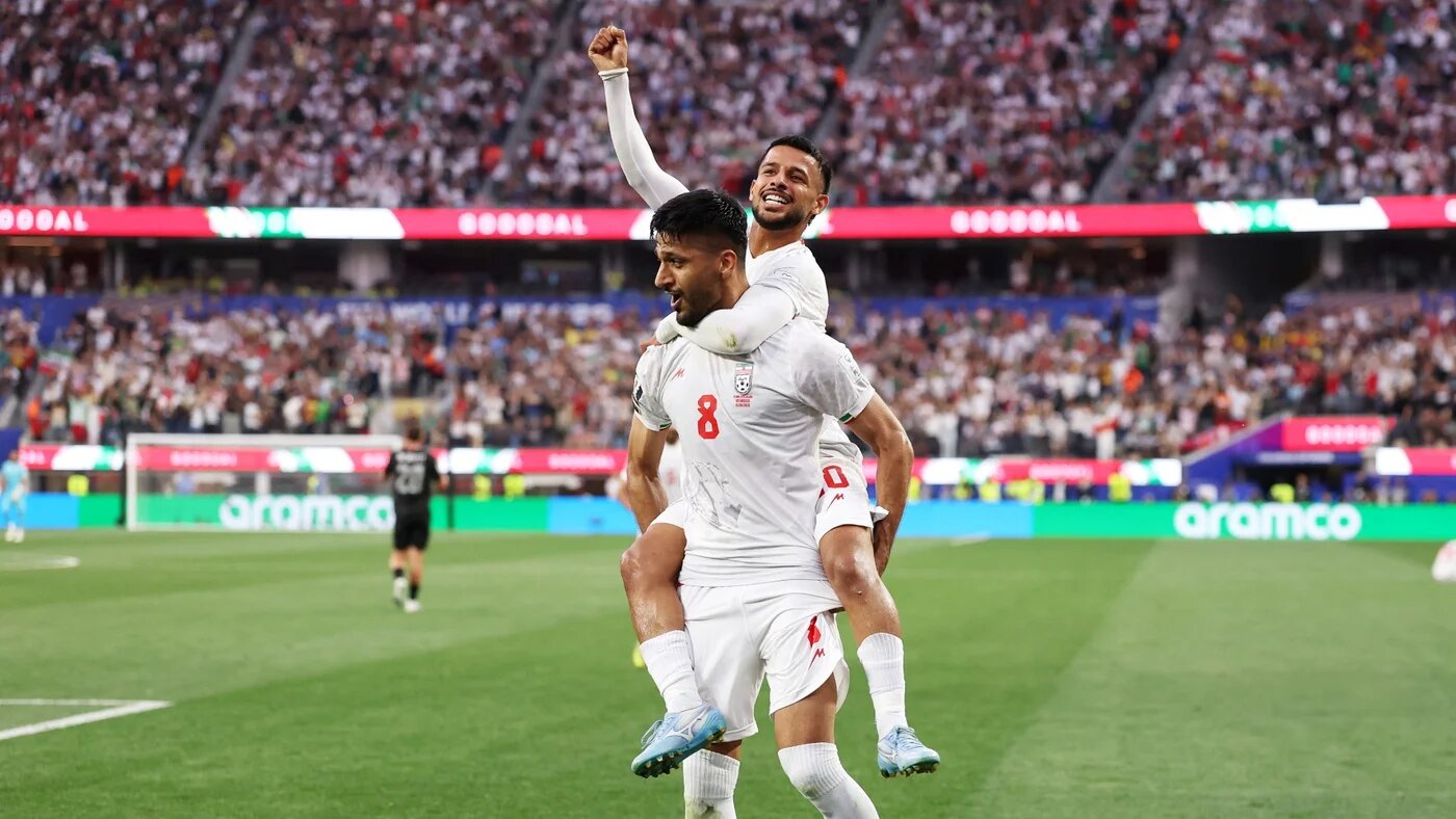 Mohammad Mohebbi and Mehdi Ghayedi celebrate after Iran scored a second goal against New Zealand at the Los Angeles Stadium in Los Angeles, California on 15 June 2026 (Richard Heathcote/Getty Images/AFP)