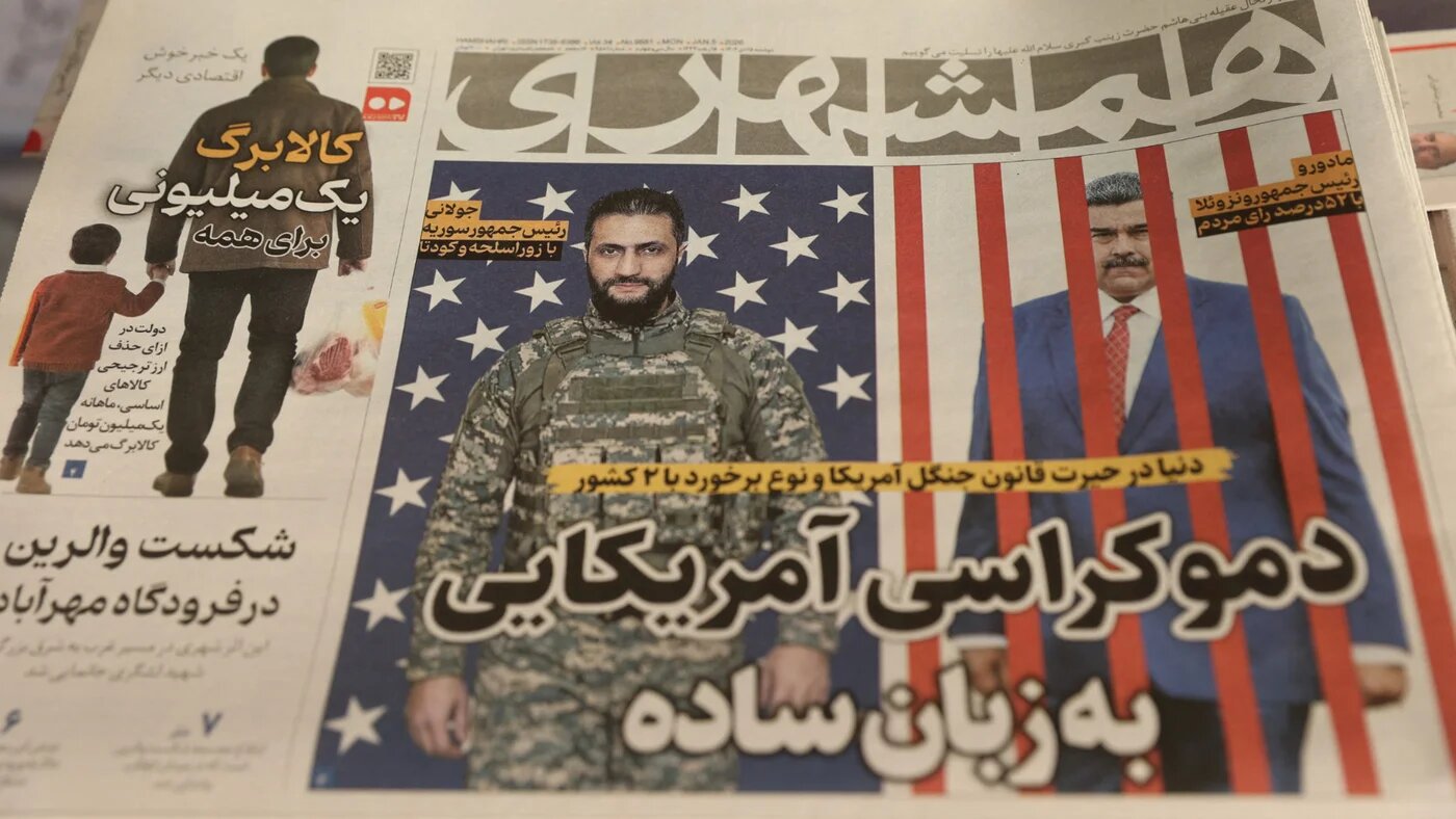 An Iranian newspaper with a cover photo of Venezuelan President Nicolas Maduro and Syria's President Ahmed al-Sharaa, in Tehran, 5 January 2026 (WANA/Reuters)