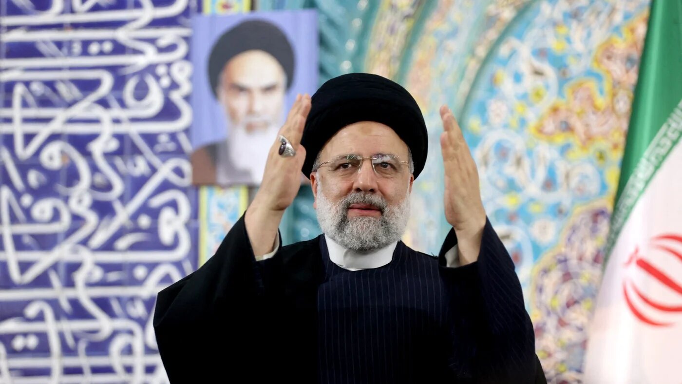 A handout picture on 2 February 2024, shows Iranian President Ebrahim Raisi greeting the crowd during his speech in city of Minab, Iran (AFP/Iranian Presidency)