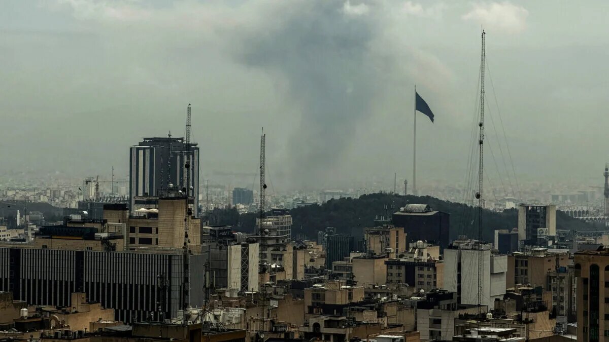 A plume of smoke rises from the site of a strike on the Iranian capital Tehran on 16 March 2026 (Atta Kenare/AFP)