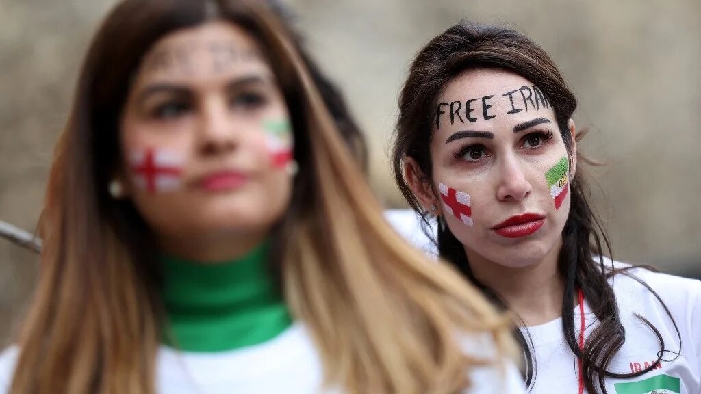 British-Iranian women take part in a demonstration in central London on 19 November 2022 (AFP)