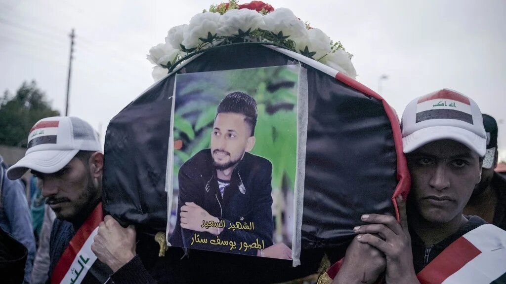 Mourners carry the coffin of Yussef Sattar, a journalist reportedly killed while covering anti-government protests in Iraq in January 2020.