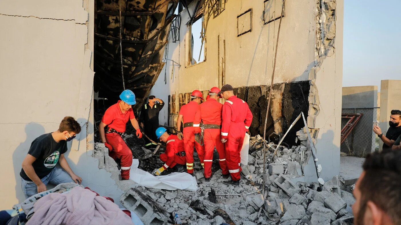 Firefighters check the damage in an event hall in Qaraqosh, also known as Hamdaniyah, after a fire broke out during a wedding on 27 September 2023 (AFP)