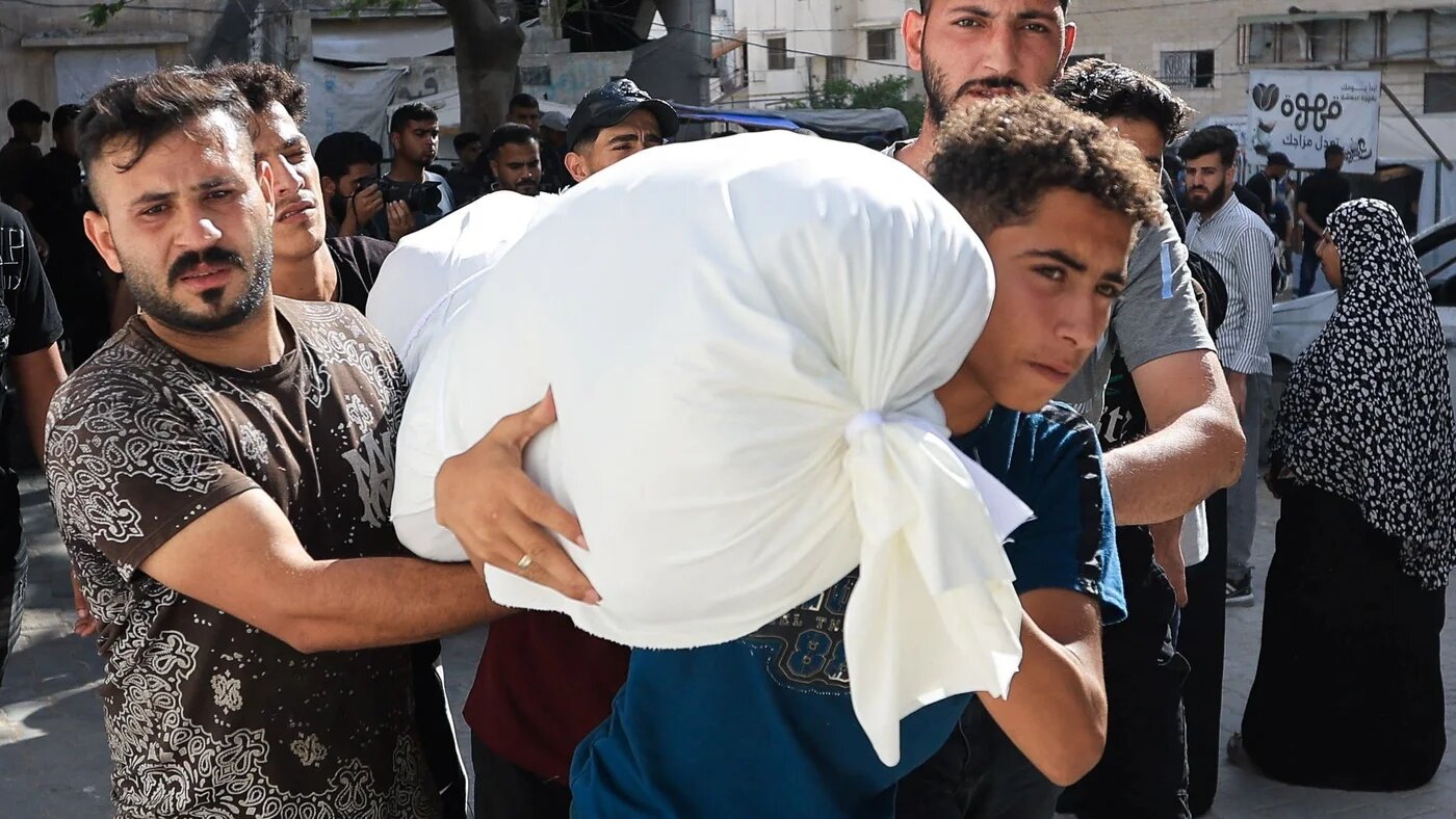 Palestinians carry the body of victims of an Israeli attack, in Gaza City, 14 June, 2026 (Dawoud Abu Alkas/Reuters)