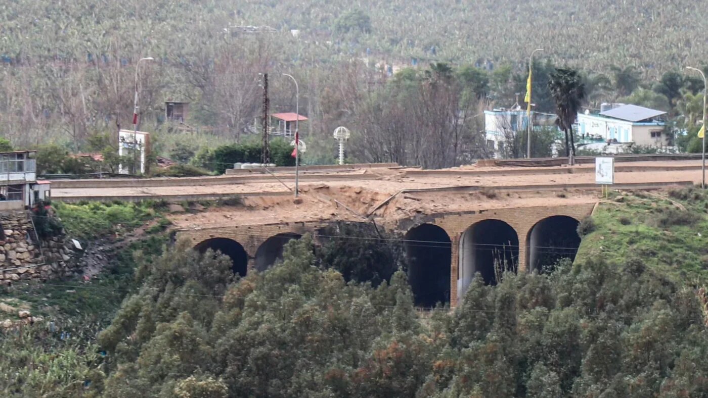 The damaged Qasmiyeh bridge, located on a main highway linking villages in the Tyre district with others further north, following an Israeli air strike in southern Lebanon on 22 March 2026 (AFP/Kawnat Haju)