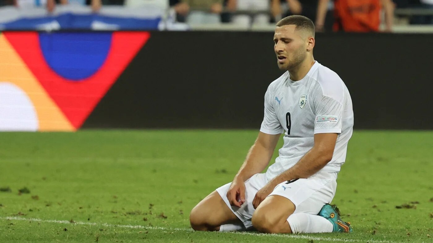 Israel's Shon Weissman reacts at the end of a match between Israel and Iceland at the Samy Ofer stadium in the Israeli city of Haifa on 2 June 2022 (Jack Guez/AFP)