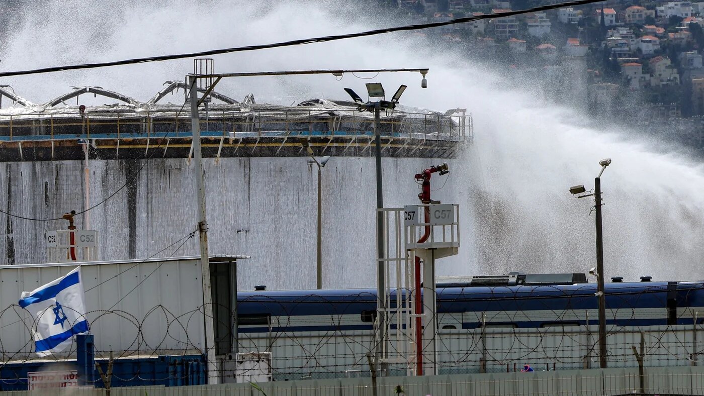 Firefighters attempt to extinguish a fire at a refinery in Israel's northern city of Haifa on 30 March 2026 following a projectile impact (Jack Guez/AFP)