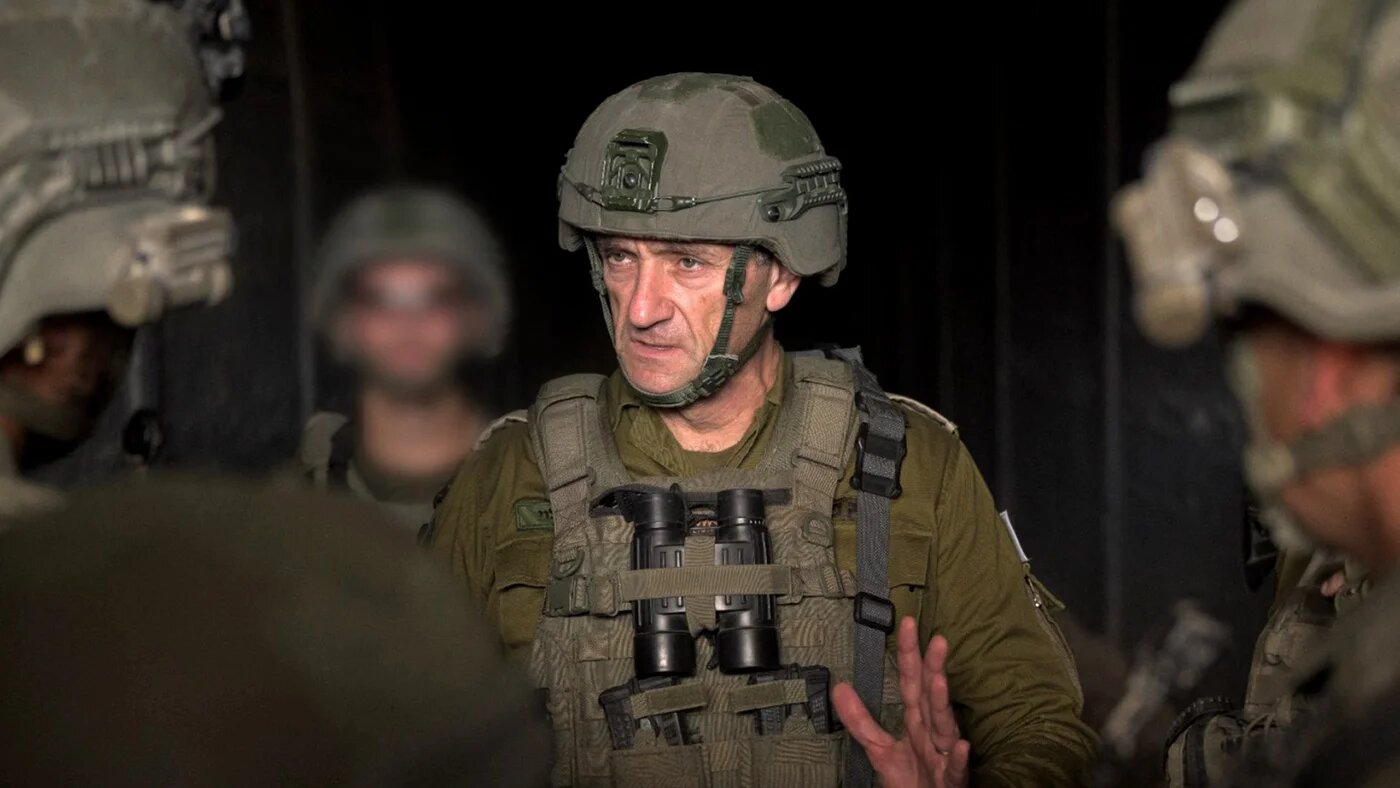 This handout picture released by the Israeli army on 14 August 2024 shows the former Israeli army chief of staff, Herzi Halevi (C), in Rafah, in the southern Gaza Strip (Israeli Army/AFP)