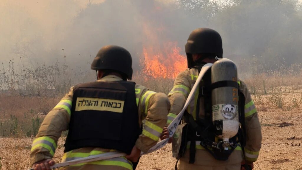 Firefighters deploy to extinguish a blaze after a drone was fired from southern Lebanon near Kfar Dishon in northern Israel on 25 June 2024 (Jack Guez/AFP)