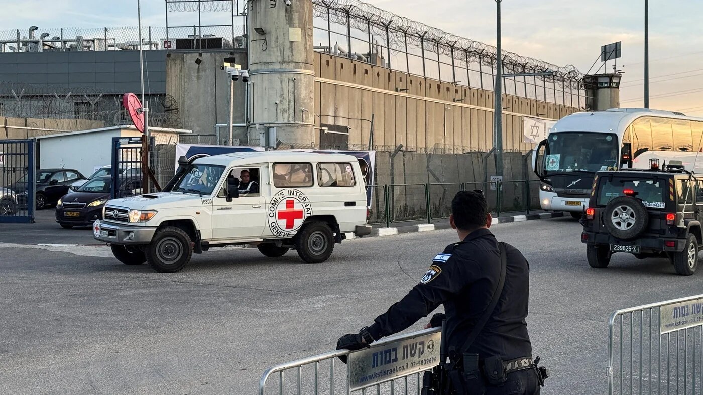 A Red Cross vehicle is seen near the Ofer Israeli military prison, in the occupied West Bank on 19 January 2025 (Reuters/Sinan Abu Mayzer)