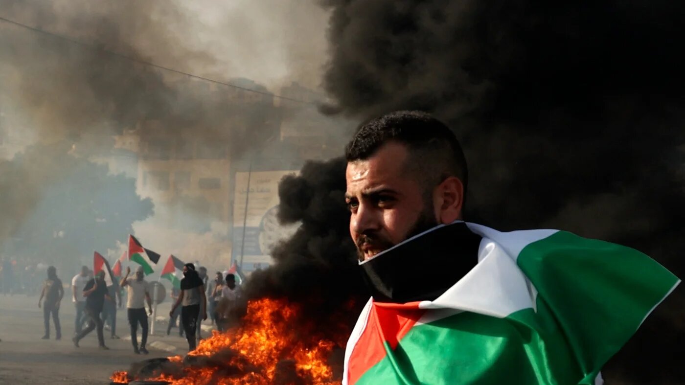 A Palestinian protester at a demonstration outside the Huwara military checkpoint near Nablus in the occupied West Bank on 29 May 2022. (AFP)