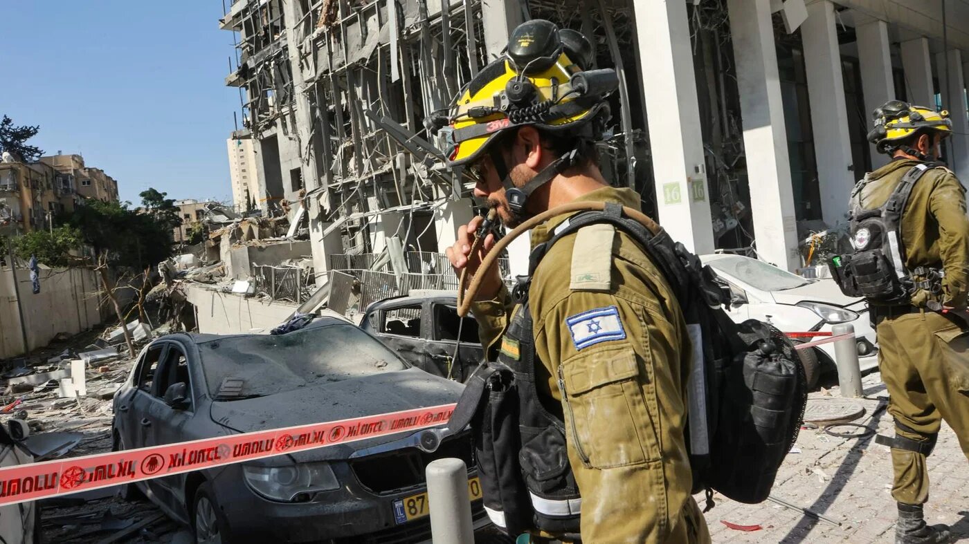 An Israeli emergency services worker at the site of an Iranian missile attack in Ramat Gan in central Israel on 19 June 2025 (Gil Cohen-Magen/AFP)