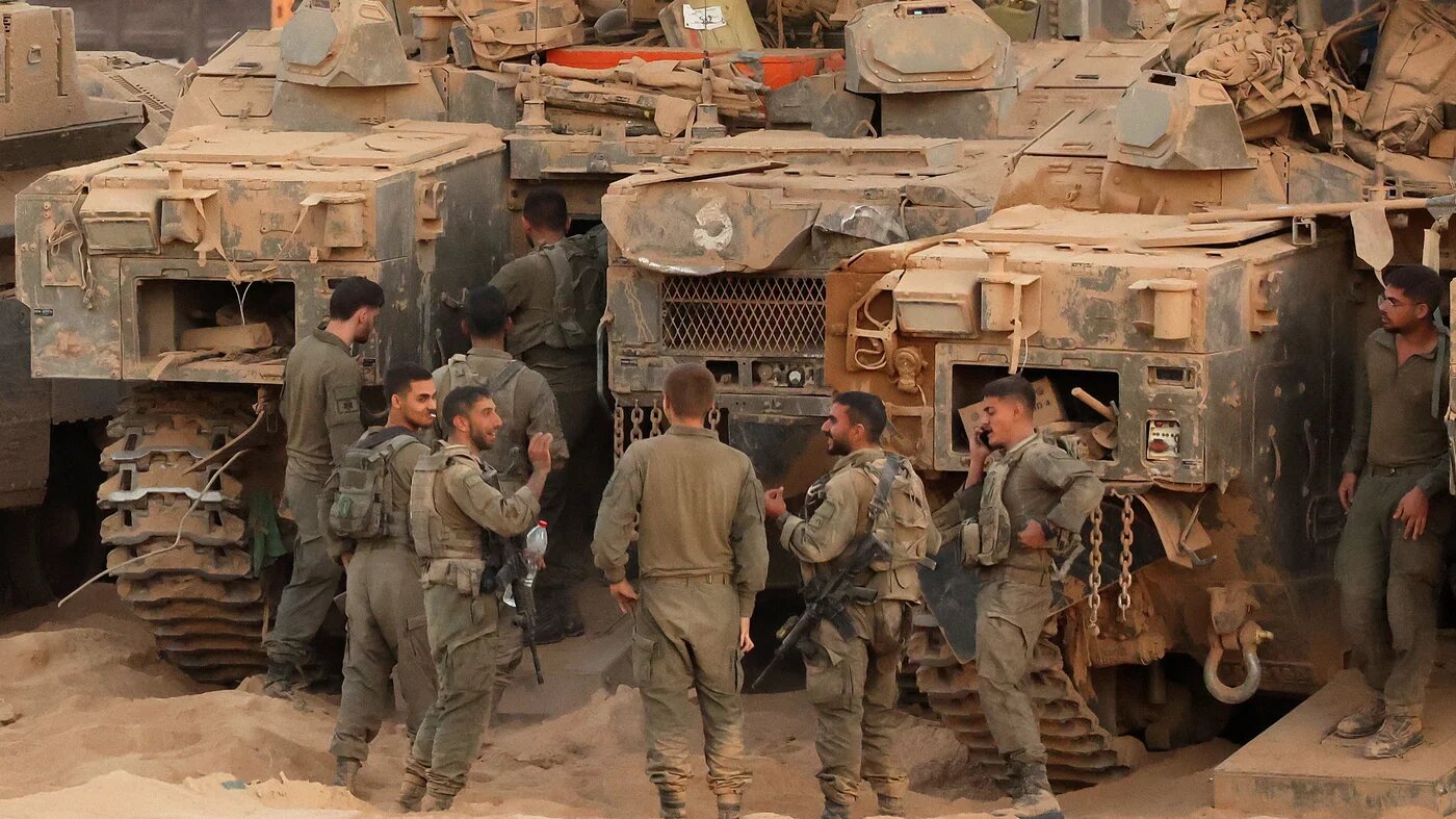 Israeli army soldiers gather near the Israel-Gaza boundary on 10 October, 2025 (Jack Guez/AFP)