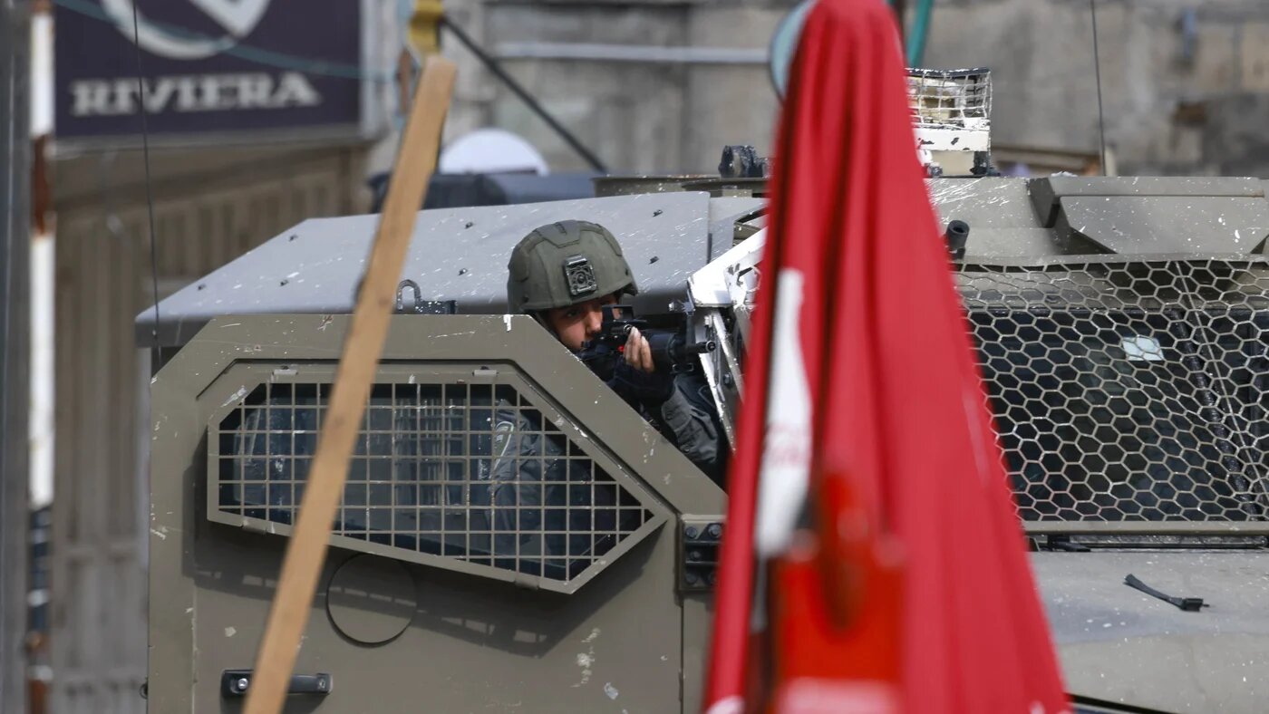 An Israeli soldier is pictured during a raid in Tulkarm in the occupied West Bank on 28 January, 2025 (AFP/Jaafar Ashtiyeh) 