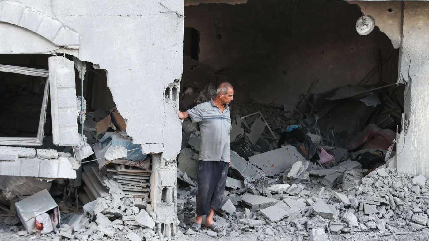 A Palestinian man checks the aftermath of an Israeli strike on a building in the Nuseirat refugee camp in the central Gaza Strip, on 25 September, 2025 (AFP/Eyad Baba)