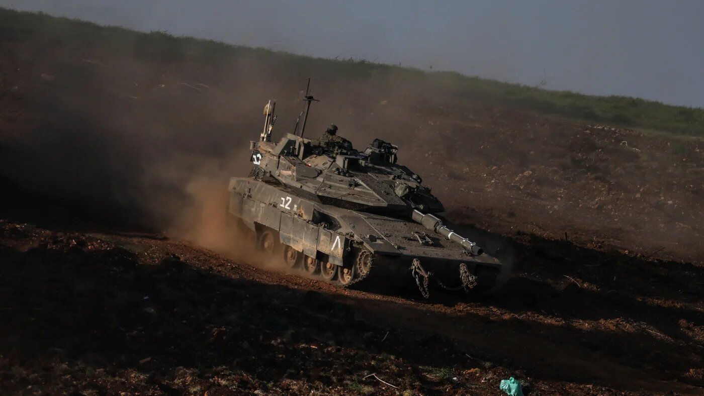 An Israeli tank manoeuvers on the Israeli side of the Lebanese-Israeli border, 12 March 2026 (Reuters)