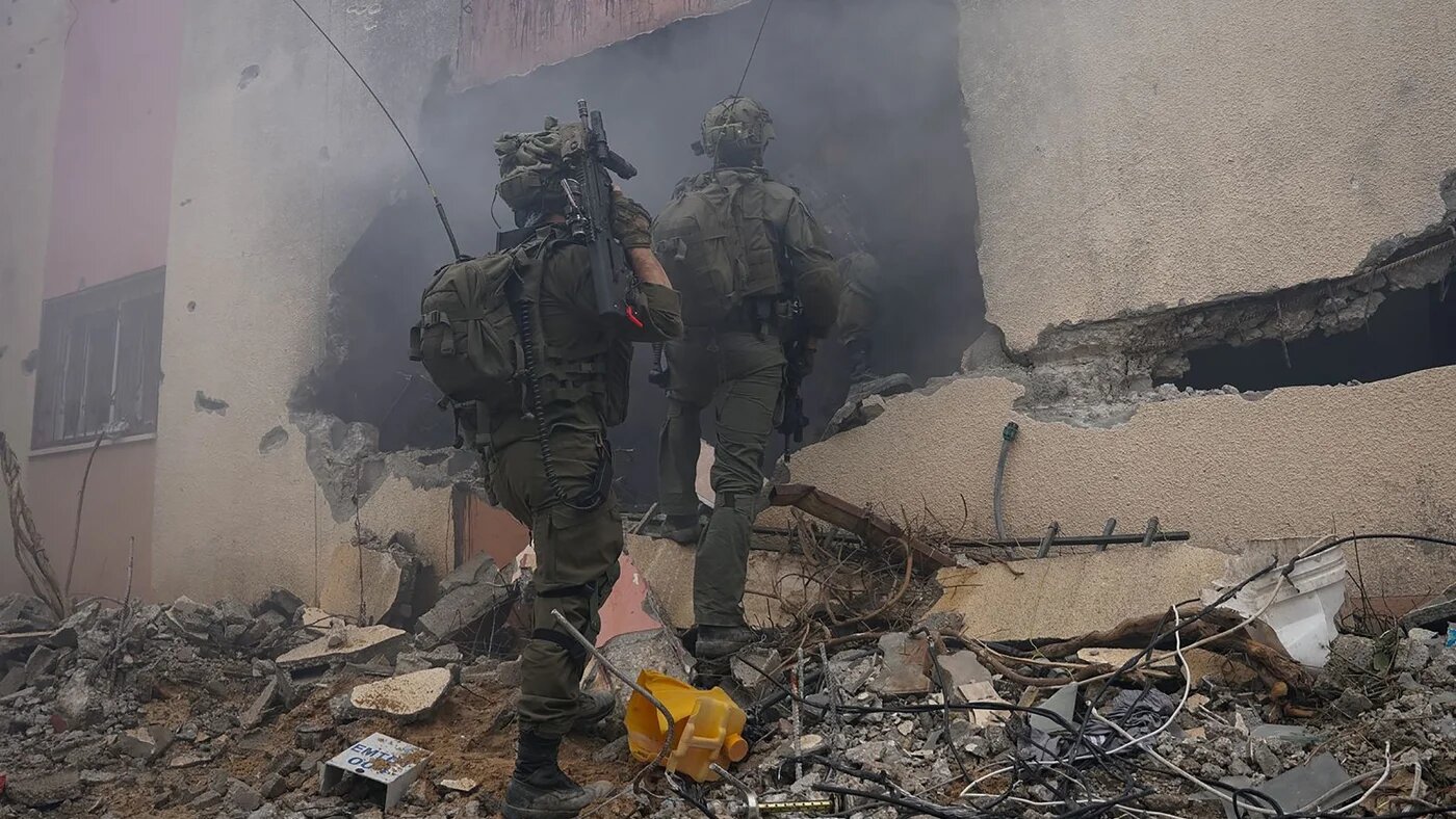 This handout picture, released by the Israeli army on 4 February 2024, shows Israeli troops in Khan Younis, in the southern Gaza Strip (AFP/Israeli army)