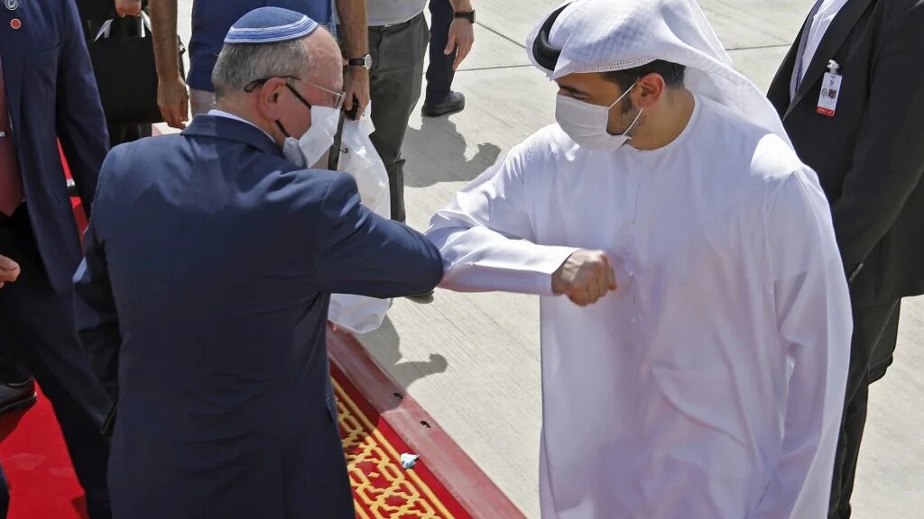 Israeli National Security Advisor Meir Ben-Shabbat elbow bumps with an Emirati official on 1 September.