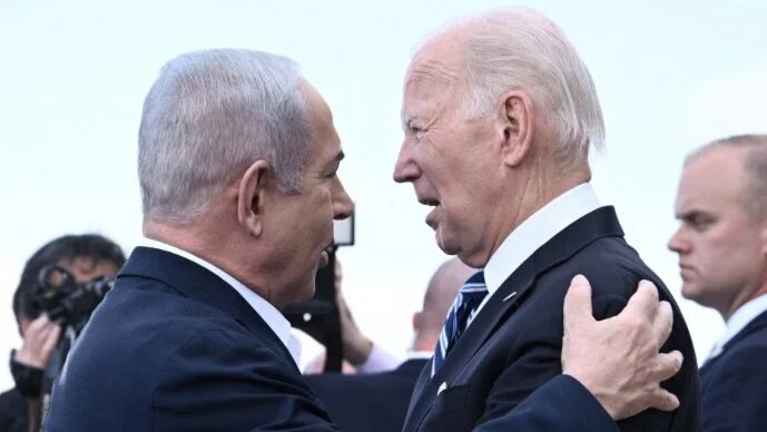 Israeli Prime Minister Benjamin Netanyahu greets US President Joe Biden in Tel Aviv on 18 October 2023 (Brendan Smialowski/AFP)
