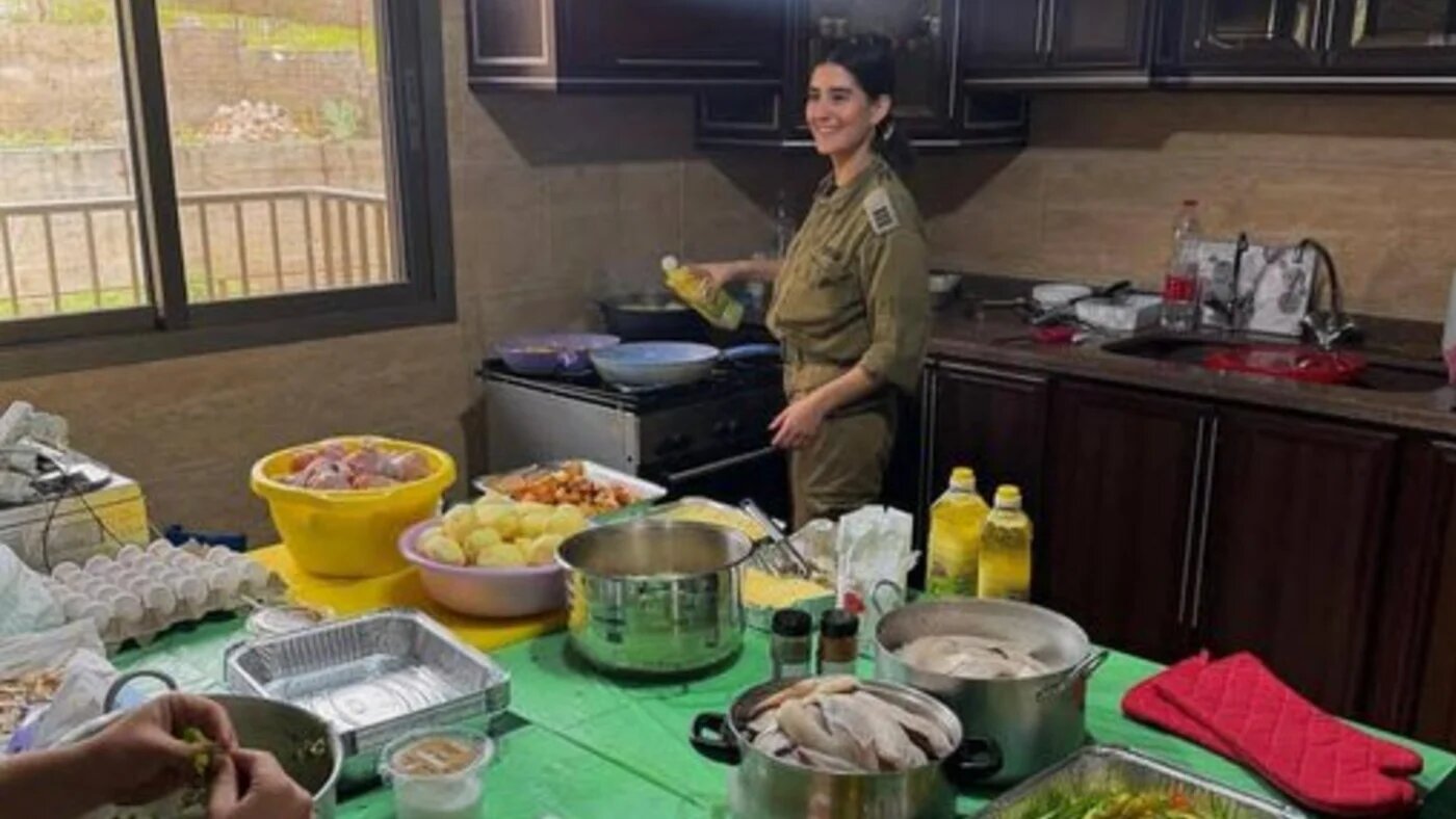 An image of an Israeli soldier cooking in a kitchen was reportedly taken in Bint Jbeil, in the Nabatiye governorate of southern Lebanon (Screengrab/Bint Jbeil News)