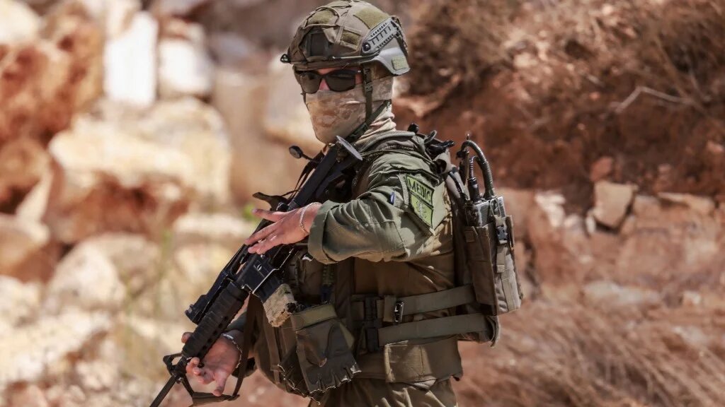 Israeli soldier stationed at the Occupied West Bank village of Qusra on August 29, 2026, amid a rise in settler attacks on the village (AFP)