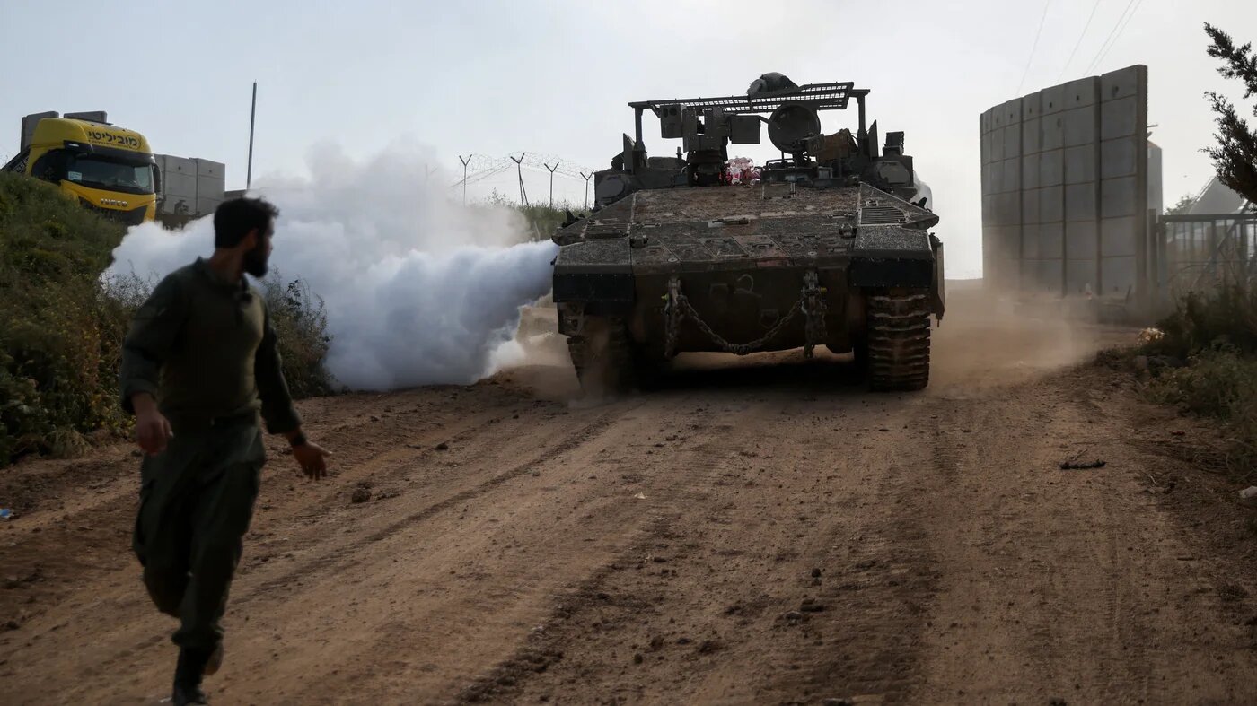 An Israeli soldier walks near a military vehicle, on the Israeli side of the Israel-Lebanon boundary, 26 April 2026 (Shir Torem/Reuters))