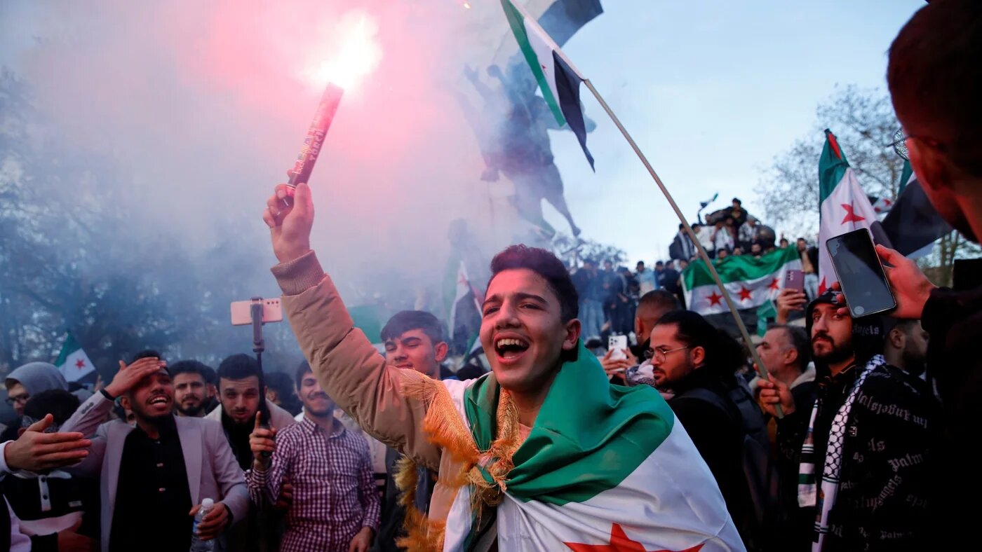 Syrians living in Turkey celebrate after rebels announced that they have ousted Bashar al-Assad in Syria, in Istanbul, 8 December (Reuters/Dilara Senkaya)