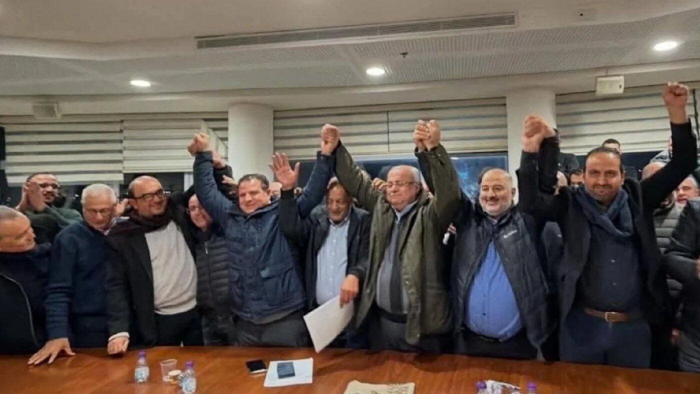 Leaders of the four parties hold hands after signing a pledge to revive the Joint List during a meeting in the northern city of Sakhnin, 22 January 2026 (X/screengrab)