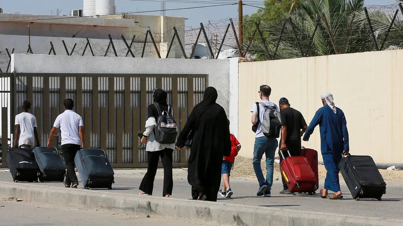 Passengers arrive on the Jordanian side of the Allenby Bridge crossing on 19 July 2022.