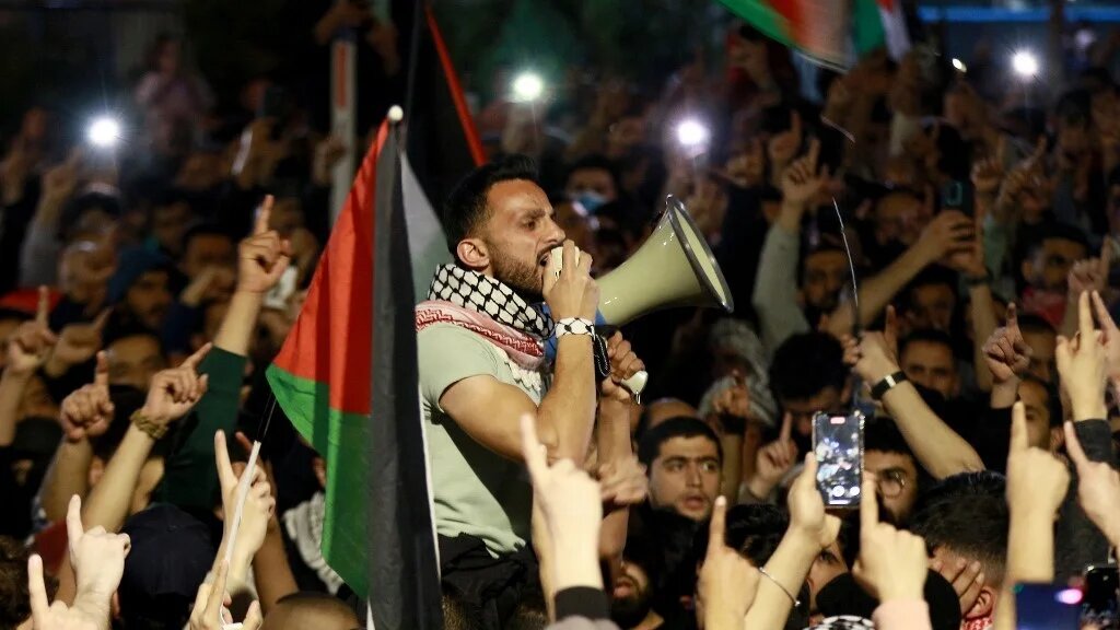 Jordanians chant slogans during a demonstration near the Embassy of Israel in Amman on 28 March 2024 (AFP)