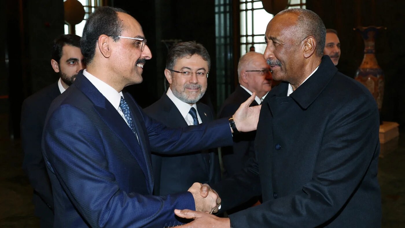 Sudan's army chief General Abdel Fattah al-Burhan (R) shaking hands with Turkey's National Intelligence Organisation director Ibrahim Kalin at the Presidential Complex in Ankara on 25 December (handout/AFP)