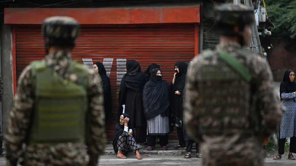 Indian paramilitary troopers stand guard as Kashmiri Muslims take part in a ceremonial Ashura procession in Srinagar, on 24 June 2026 (Tauseef Mustafa/AFP)