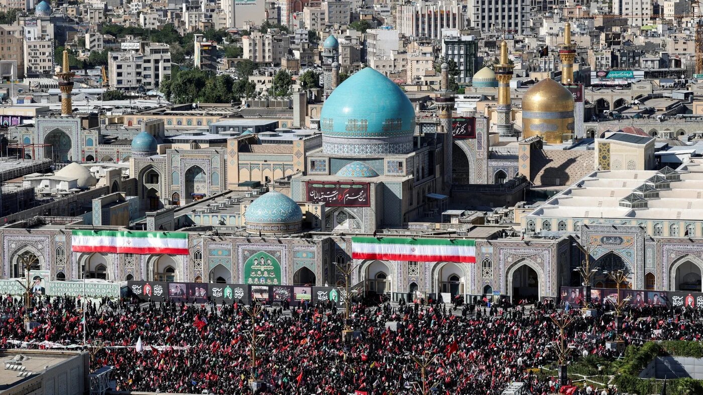 Mourners gather by Imam Reza shrine for the burial of Ayatollah Ali Khamenei, 9 July 2026 (Mohammed Salem/Reuters)