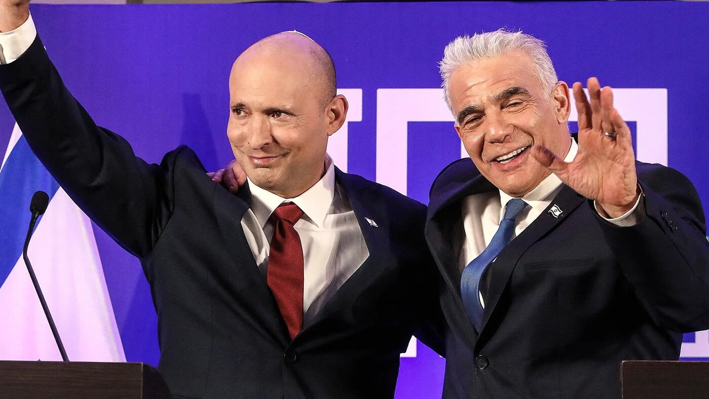Former Israeli Prime Minister Naftali Bennett and Israeli opposition leader Yair Lapid announce their political union ahead of this year's general election, in Herzliya, Israel, 26 April, 2026. (Reuters/ Gideon Markowicz)