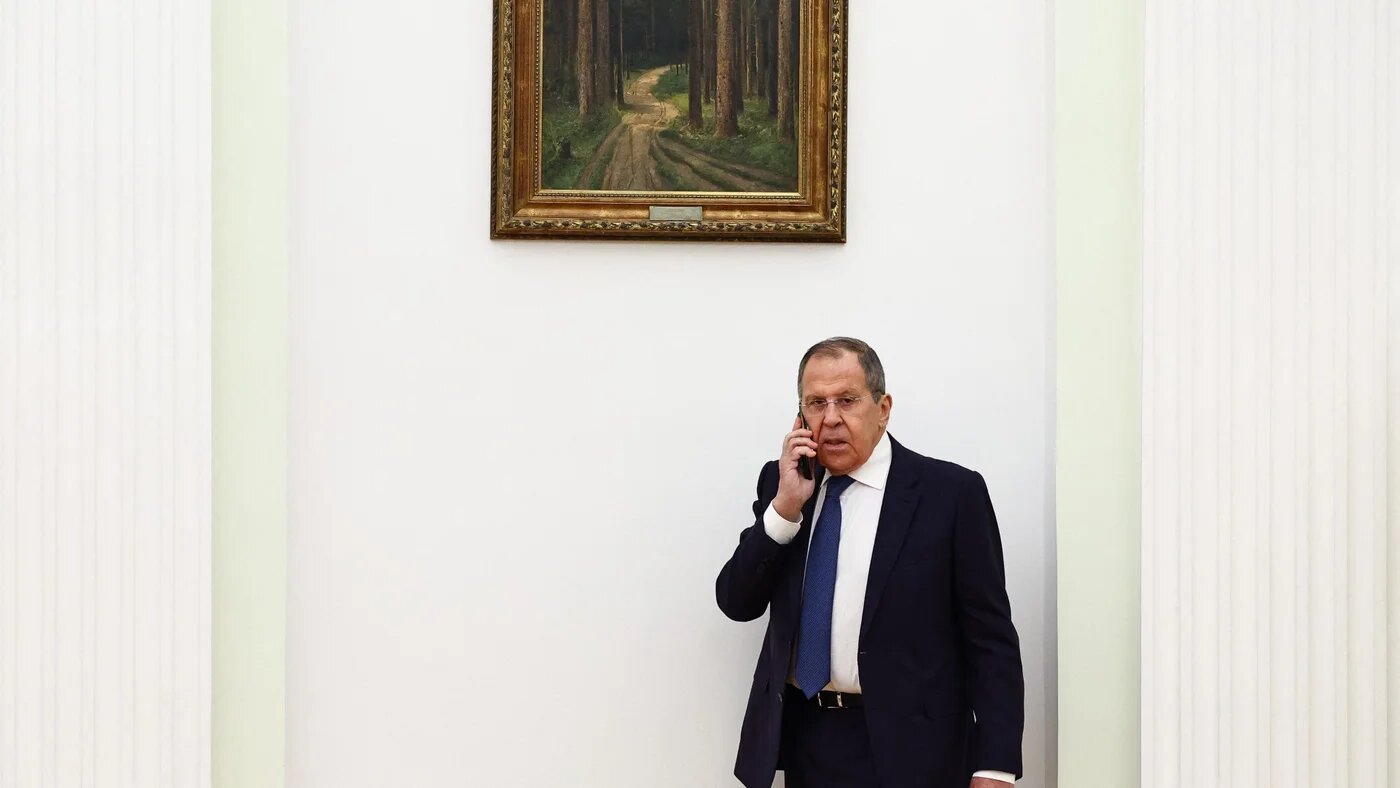 Russian Foreign Minister Sergei Lavrov talks on a phone at the Kremlin in Moscow on 16 January (Evgenia Novozhenina/AFP)