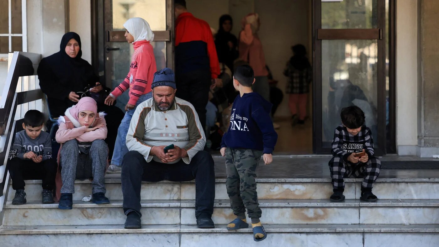 Displaced people gather at a school turned into a shelter following an escalation between Hezbollah and Israel, amid the US-Israeli conflict with Iran, in Beirut, 3 March 2026 (Reuters/Mohamed Azakir)