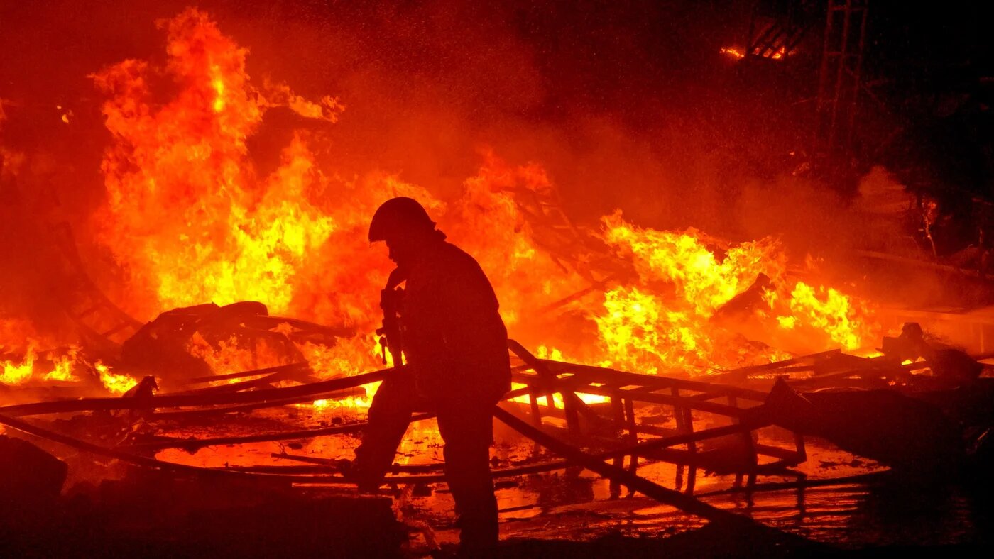 Civil defence forces attempt to extinguish a blaze that erupted after Israeli bombardment on a solar farm and electricity generation facility in Lebanon's southern coastal city of Tyre on 4 March 2026 (Kawnat Haju/AFP)