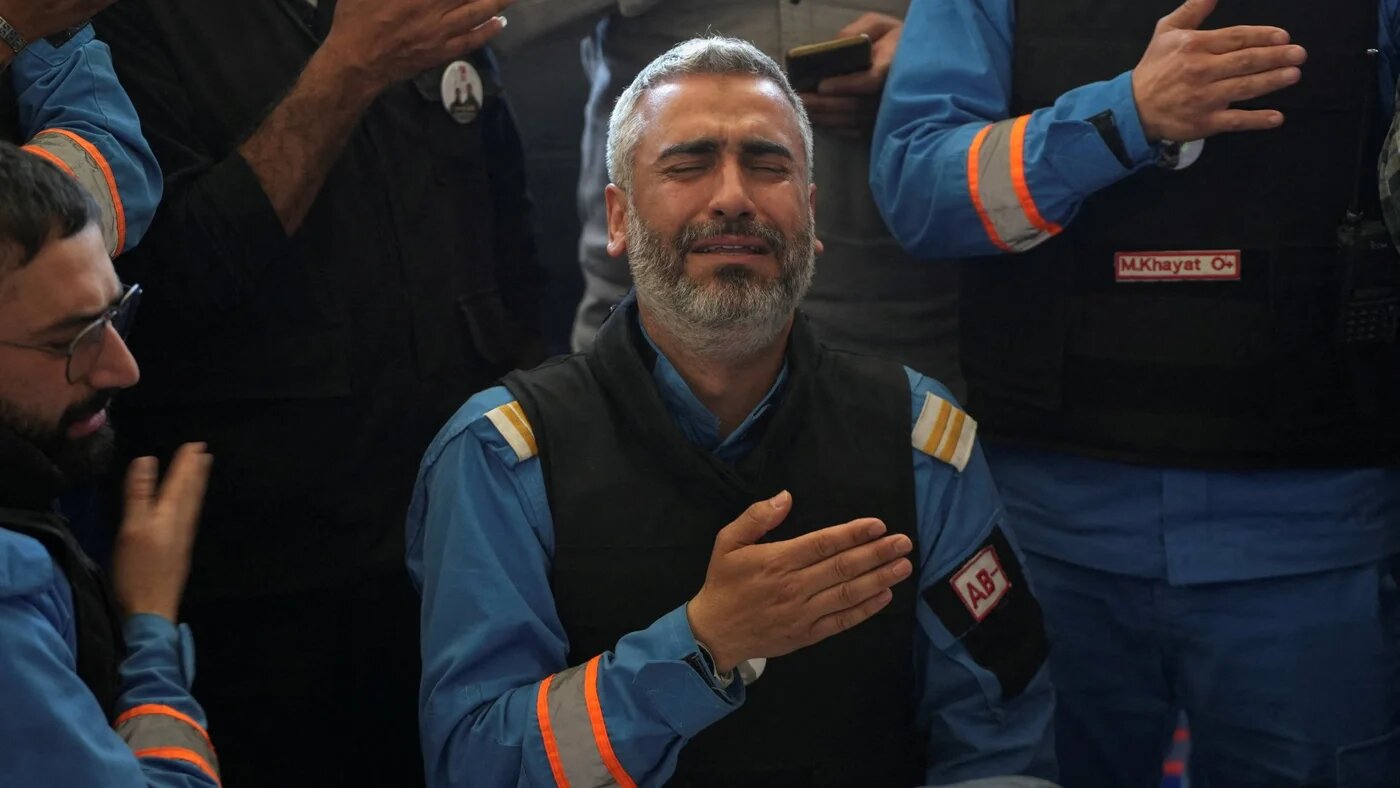 Colleagues of paramedic Mahdi Abu Zaid, who was killed in an Israeli strike, mourn during his funeral in Nabatieh, Lebanon, 16 April 2026 (Reuters)
