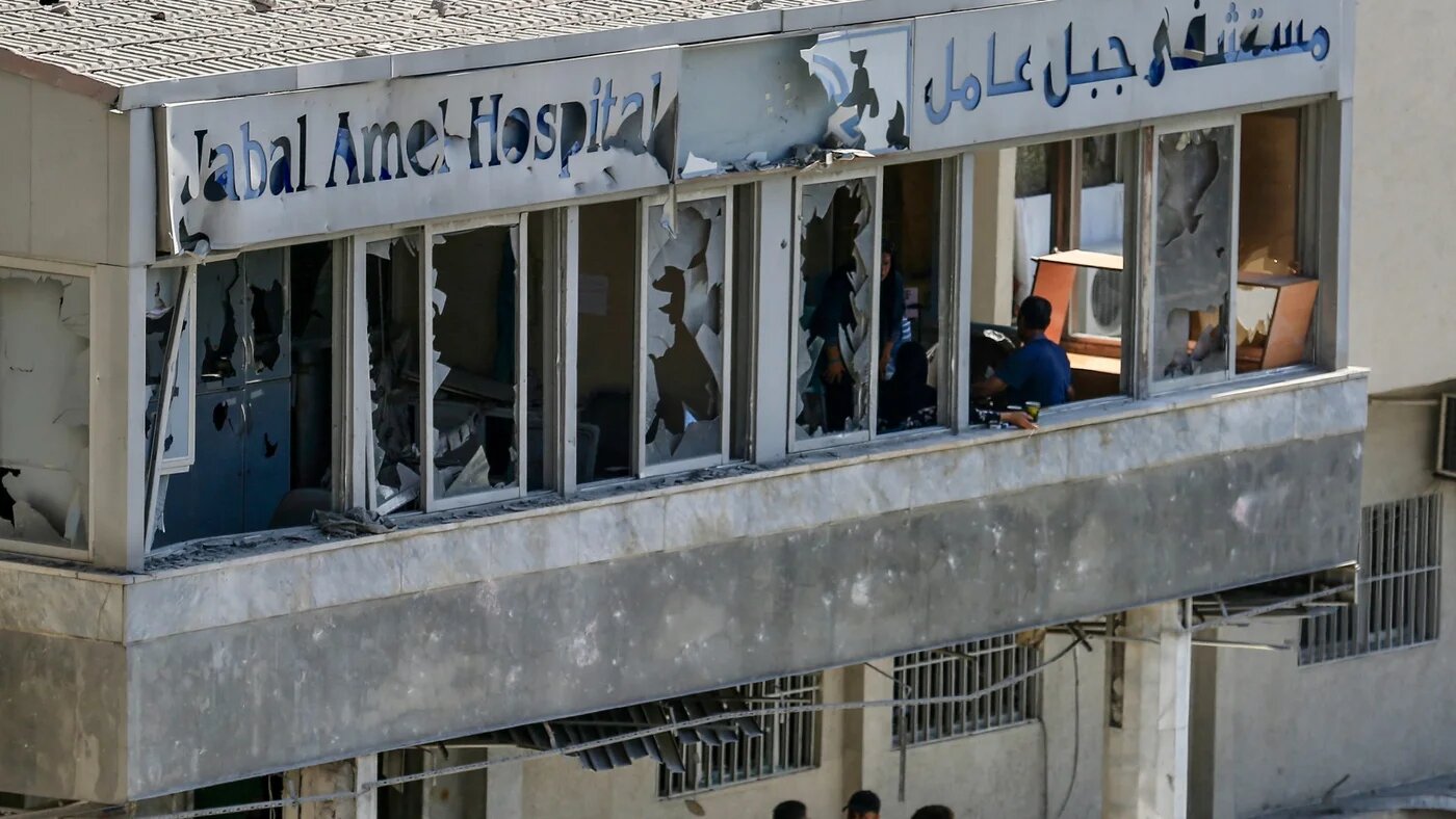 A photograph shows the damage at the entrance of a hospital near the site where an Israeli air strike struck a building the previous day in the southern port city of Tyre on 2 June 2026 (AFP)