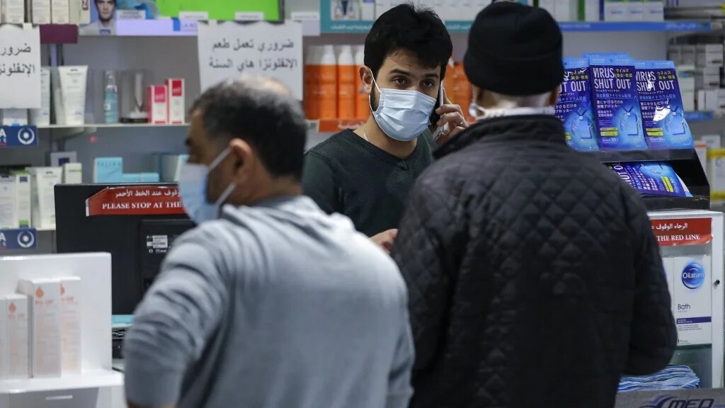 Customers buy medicine at a pharmacy in the Lebanese capital Beirut, on 2 February 2021.