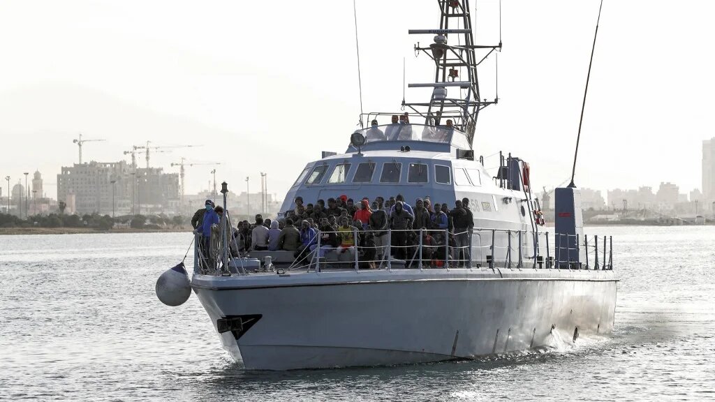 Migrants arrive in Tripoli on 29 April 2021 after the coastguard intercepted an boat carrying 99 migrants off its west coast.