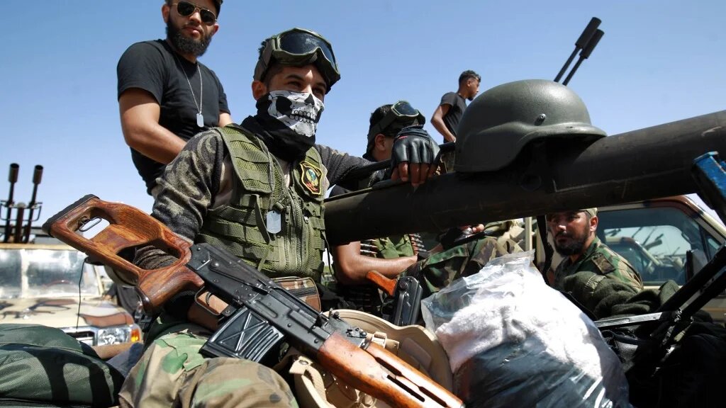 Members of Khalifa Haftar's self-proclaimed Libyan National Army gather in the city of Benghazi, on their way to Sirte