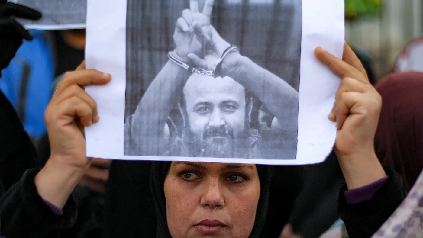 People protest for Marwan Barghouti and other prisoners in the Bureij refugee camp, central Gaza Strip, on 4 April, 2026 (AFP/Eyad Baba)