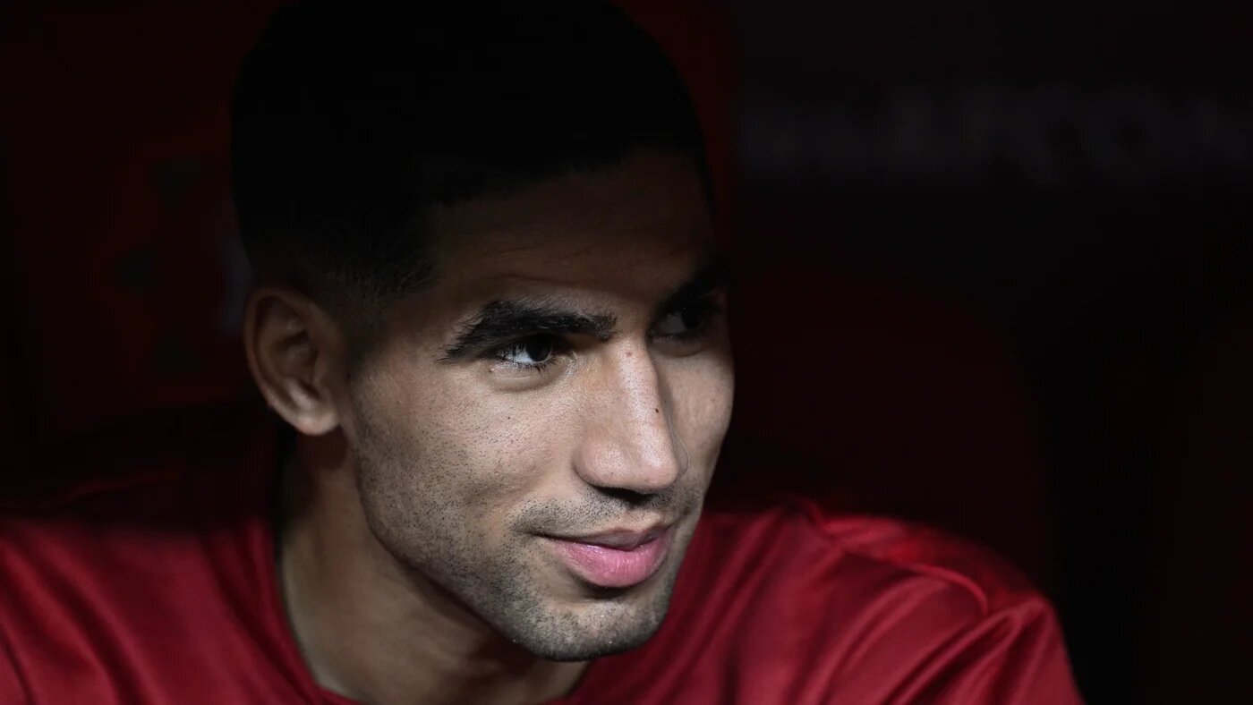 Morocco's Achraf Hakimi looks on from the substitutes bench at the Prince Moulay Abdellah Stadium in Rabat on 29 December 2025 (AFP/Gabriel Bouys)