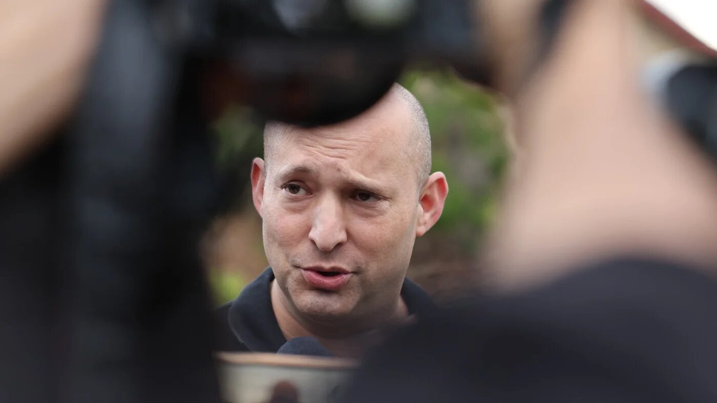 Naftali Bennett speaks to media, 15 January 2024 (Jack Guez/AFP)
