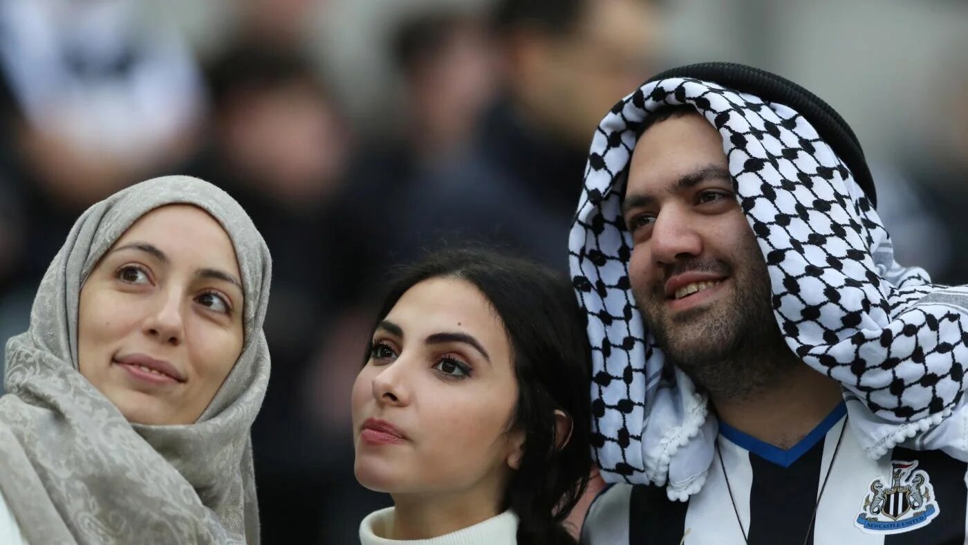 Football fans posing for photo ahead of a match