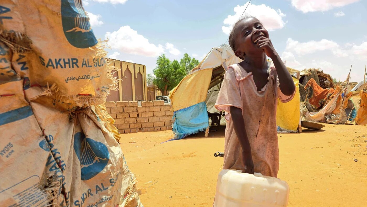 A Sudanese girl in al-Rahmaniyah camp for displaced people, near the city of el-Obeid in the Kordofan region, on 25 June 2026 (AFP)