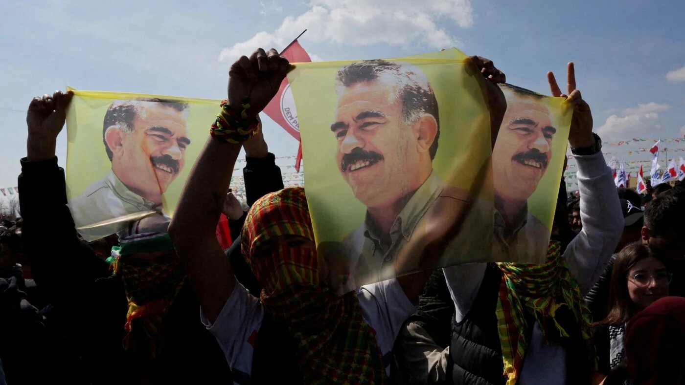 Supporters of pro-Kurdish Dem Party display flags with a portrait of Abdullah Ocalan, during a rally to celebrate Nowruz in Istanbul 17 March 2024 (Reuters/Umit Bektas)