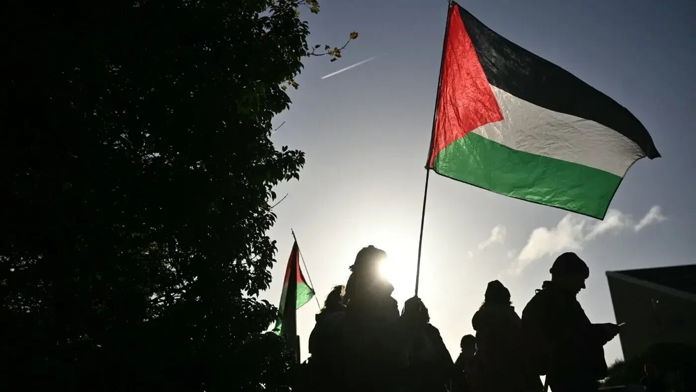 Protesters outside Woolwich Crown Court in London, where alleged Palestine Action activists are on trial, 17 November 2025 (AFP)