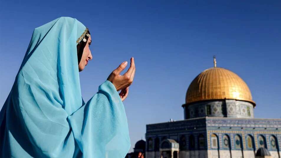 A woman prays at Al-Aqsa Mosque complex in occupied East Jerusalem’s Old City on 27 September 2023 (Ahmad Gharabli/AFP)